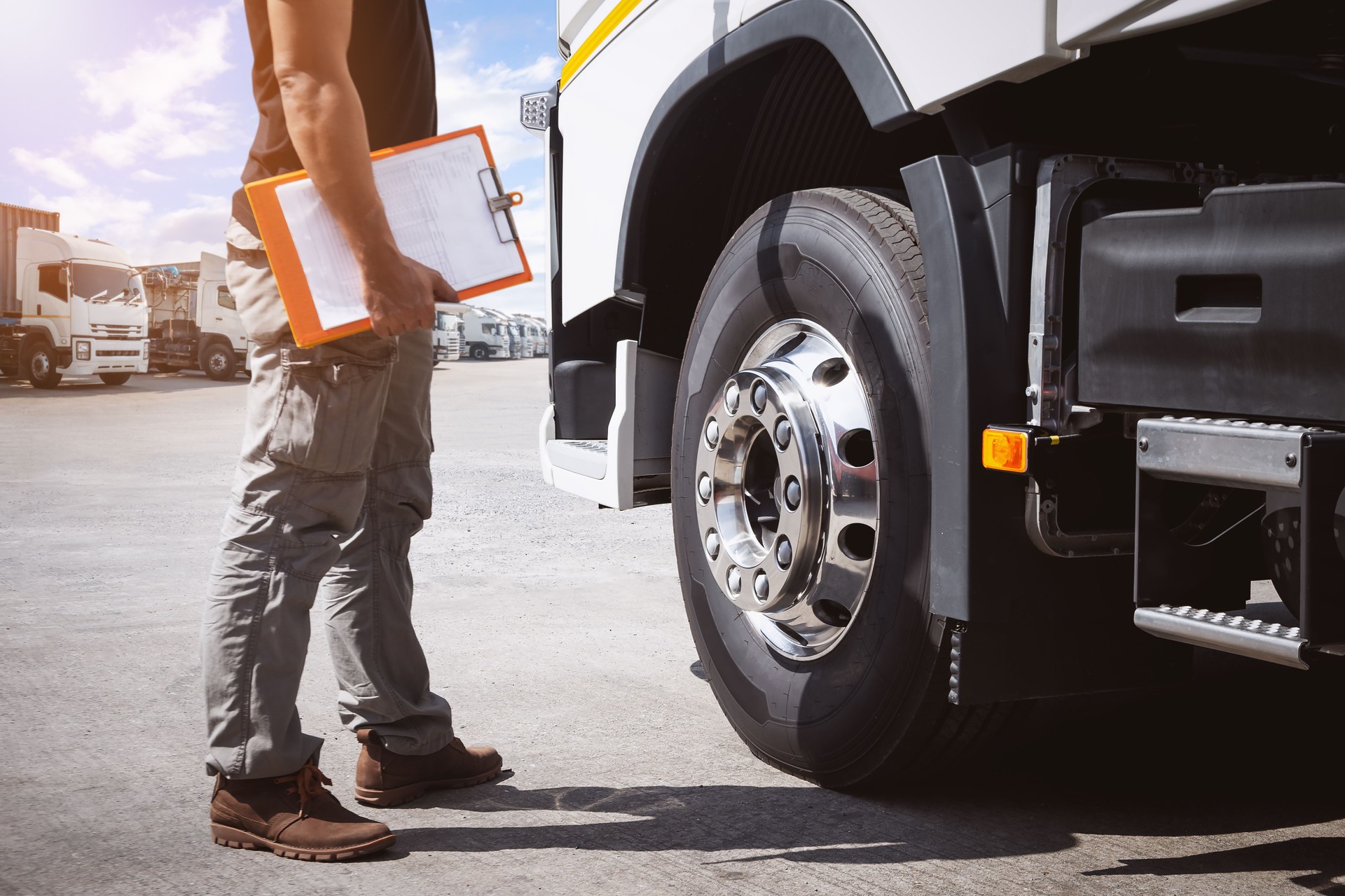 Truck Drivers Holding Clipboard to Check Truck Tires. Semi Truck Tractor, Big rig. Maintenance Safety Checklist, Inspecting Safety Driving. Freight Logistics  Truck Transportation.